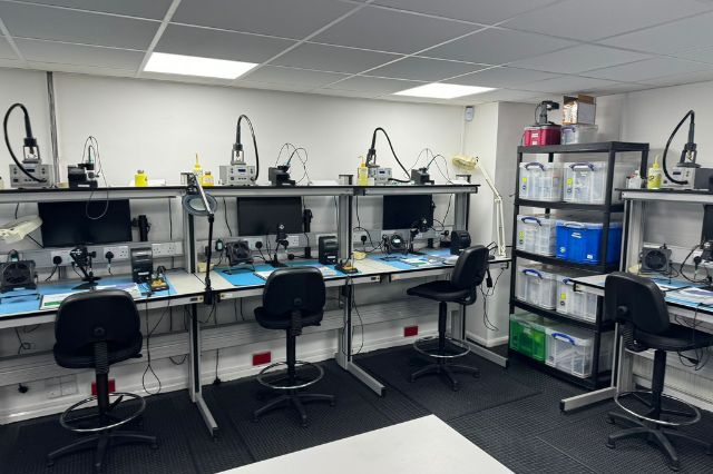 an electronics workshop with work benches and equipment set up ready for an electronics skills course