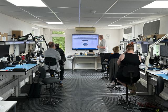 an electronics trainer teaching an IPC class in a workshop