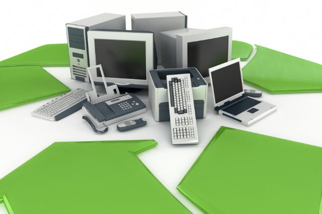 a pile of electronics devices shown inside a recyclying symbol to show sustainability as a benefit of NDT